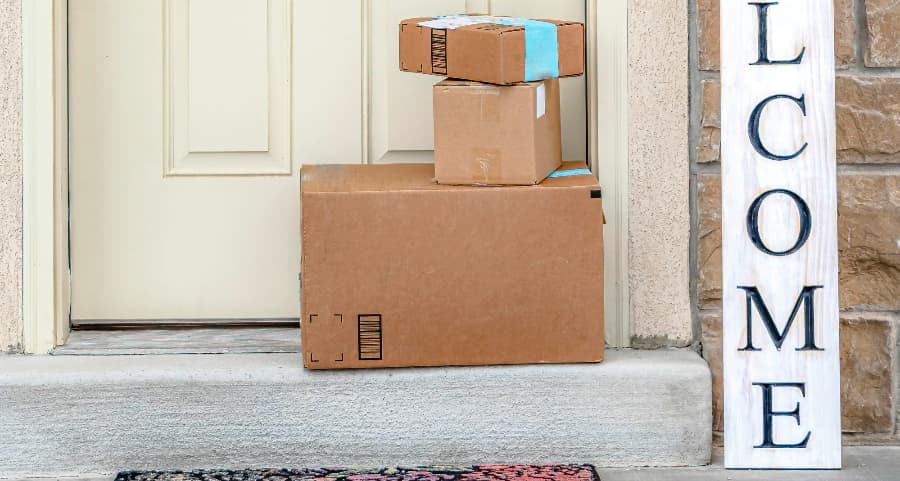 Deliveries on the front porch of a house with a welcome sign in Corpus Christi